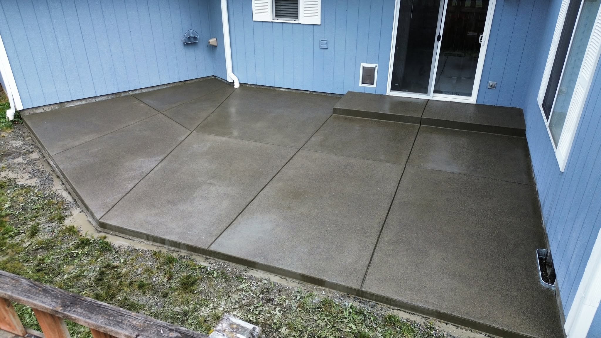 Finished concrete back patio ready for furniture